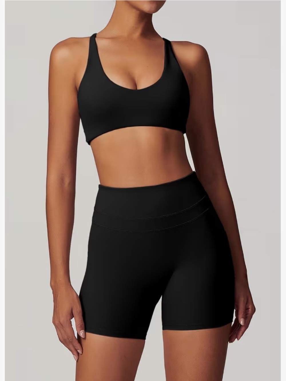 Black high-waisted bike shorts and twist back crop top